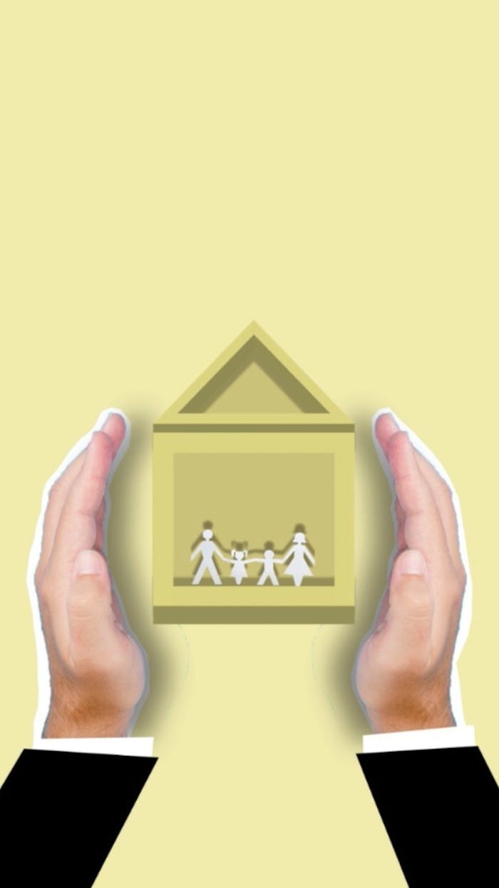 services-02 Creative image of cutout faceless person showing vector house image with family members inside